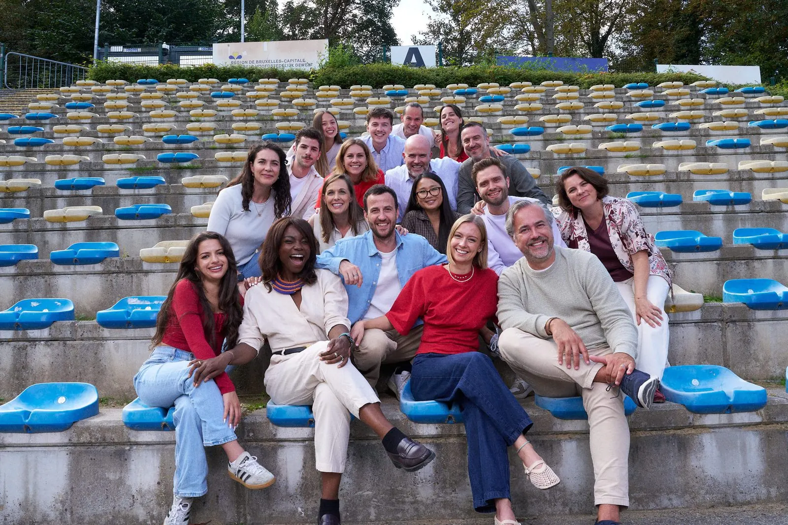 The Brum Smith team, laughing together on the stands of a Brussels stadium